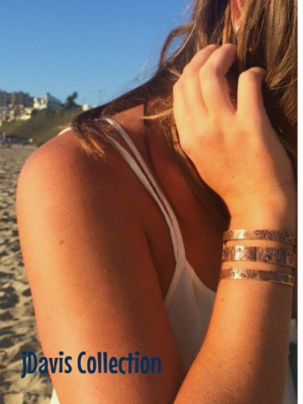 wide copper cuff on arm at beach